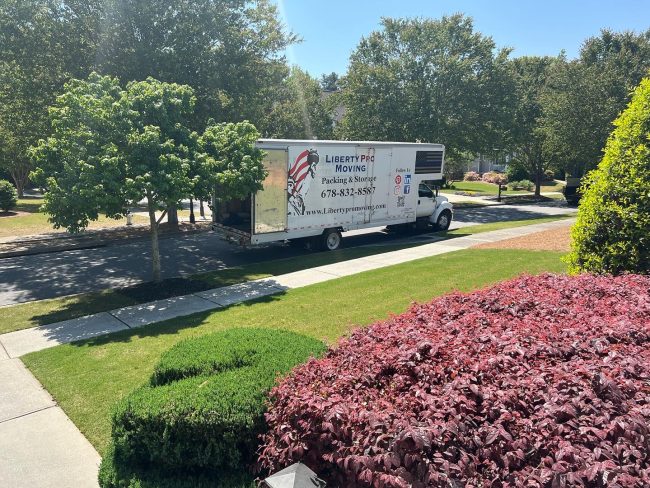 movers loading furniture into moving truck in Lawrenceville GA