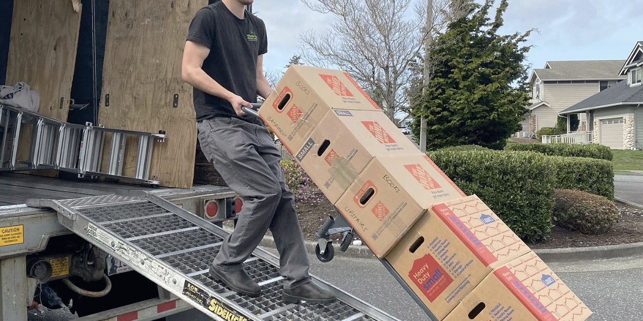 moving truck being packed by professional movers moving truck being packed by professional movers